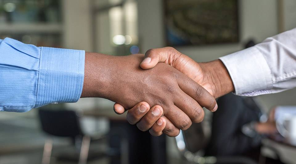 Two business men shaking hands