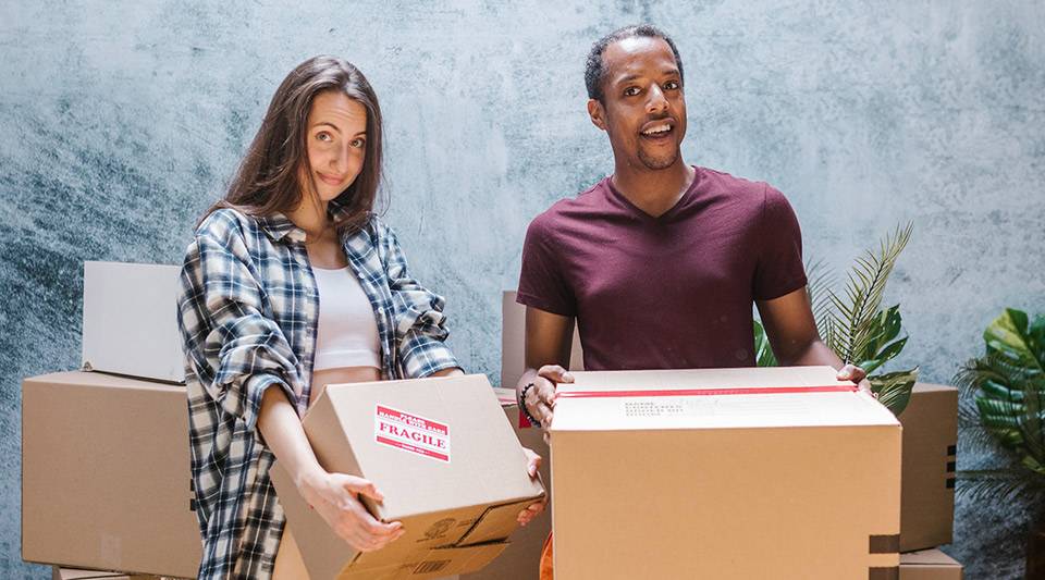 A happy couple packing boxes